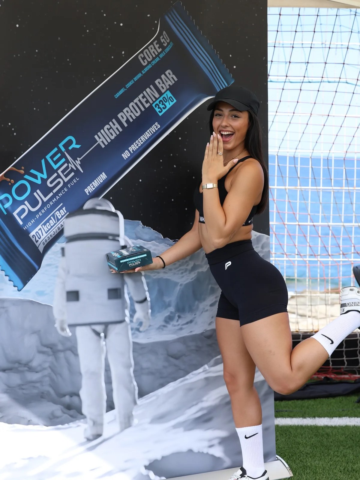 A PowerPulse event stand built as a lunar surface, with a banner and an astronaut figure